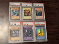 Yugioh PSA Lot Includes Blue Eyes White Dragon/Winged Dragon Of Ra/ Dark Sage - Image 1