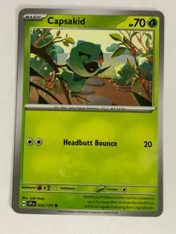 Pokemon TCG Surging Sparks Blue Printer Hickey Error Capsakid 012/191 Near Mint - Image 1