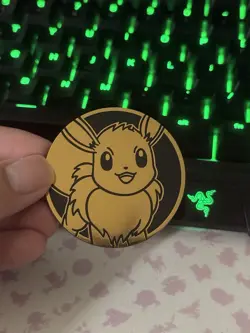 Prismatic Evolutions Eevee 2025 Pokemon Day Promo Coin - Image 1