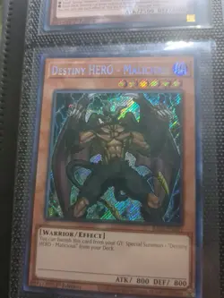 Yugioh Destiny Hero Malicious RA03-EN001 1ST SECRET (NM) - Image 1