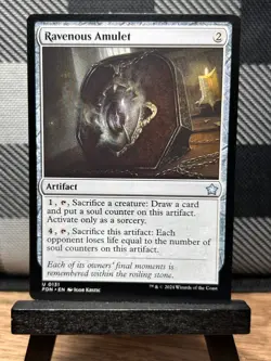 MTG TCG: Ravenous Amulet 131, Foundations - Image 1