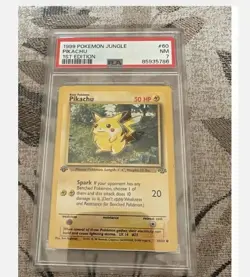 1999 Pokemon Jungle #60 Pikachu Near Mint 1st Edition PSA 7 NM - Image 1