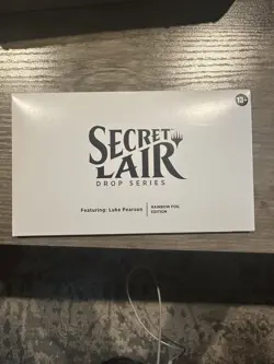 MTG Secret Lair Luke Pearson Rainbow Foil Card Sealed in Hand - Image 1