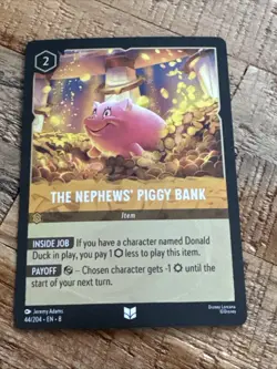 2025 Disney Lorcana Reign Of Jafar #44 Nephews’ Piggy Bank Cold Foil TCG Card - Image 1