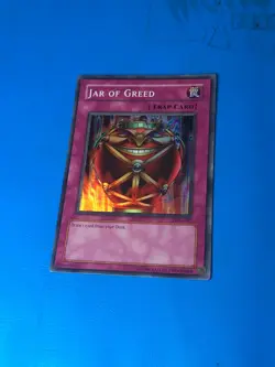 YUGIOH Super Rare Jar Of Greed LON-047 PLAYED - Image 1