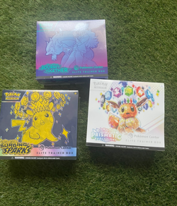 Pokemon center elite trainer box bundle: Prismatic, Surging Sparks and Journey - Image 1