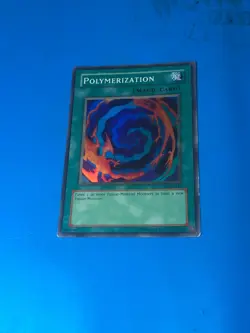 YUGIOH Super Rare Polymerization LOB-E047 PLAYED - Image 1