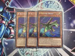 B-Buster Drake LCKC-EN020 | Yugioh! 1st Edition Secret Rare Playset (x3) - Image 1