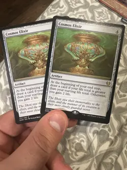 2x Cosmos Elixir 237/285 Kaldheim LP MTG - Image 1
