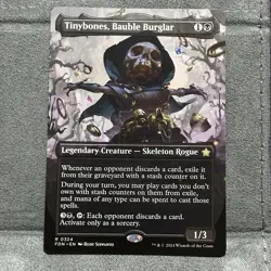 x1 Tinybones, Bauble Burglar Borderless R MTG Foundations M/NM, English In Hand - Image 1