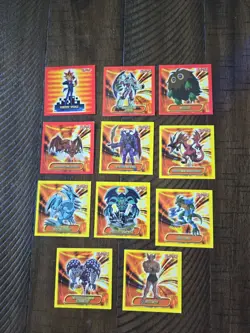 1996 Topps YuGiOh Square Red and Yellow Stickers - Lot of 11 - Image 1