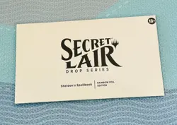 MTG Secret Lair: Sheldon's Spellbook Rainbow Foil Factory Sealed - Image 1