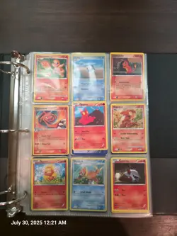 Roughly 200 random assorted pokemon cards in a binder - Image 1