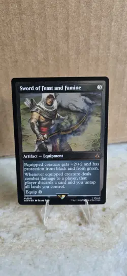 MTG Sword of Feast and Famine - Foil Etched, NM-Mint, English Universes Beyond: - Image 1