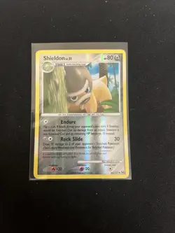 2009 Pokemon TCG Shieldon 62/127 Platinum Reverse Holo HP-MP - Image 1