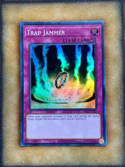 Yugioh Trap Jammer IOC-EN110 Super Rare 25th Anniversary NM - Image 1