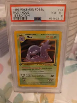 1999 WOTC POKEMON FOSSIL 1ST EDITION MUK 13/62 HOLO RARE PSA 8 - Image 1