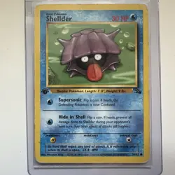 Shellder 1st Edition 54/62 Fossil WOTC 1999 Pokemon Card - Played - Image 1