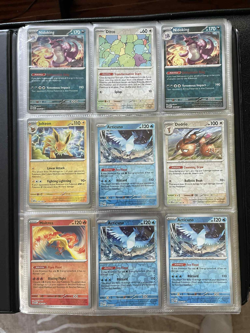 Stellar form Terapagos & Lapras Binder with 135 Pokemon Reverse Holo Rares - Image 1
