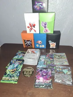 Pokemon Cards 100-Card Lot With Doube Rare And 2 Packs Of Koren Mask Of Change - Image 1