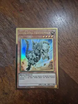 Yugioh Fossil Dyna Pachycephalo MGED-EN008 1st Ed Premium Gold Rare - Image 1