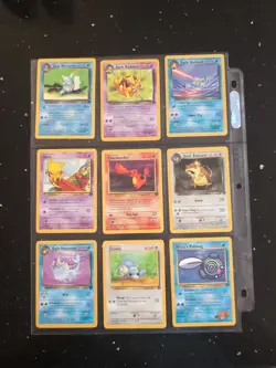 Lot Of 9 Pokemon Cards In Binder Sheet - Image 1