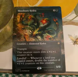 Mossborn Hydra (Borderless) - Near Mint MTG Foundations - Image 1