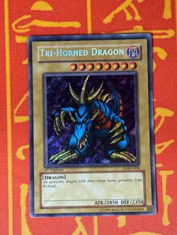 YUGIOH TRI-HORNED DRAGON SECRET RARE 1ST EDITION LIGHT PLAY LOB-E000 - Image 1
