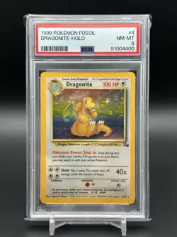 1999 POKEMON FOSSIL #4 DRAGONITE-HOLO PSA 8 - Image 1