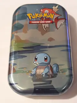 Pokemon cards in a tin. Sealed pack of basic energy cards with a free coin! - Image 1