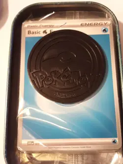 Pokemon cards in a tin. Sealed pack of basic energy cards with a free coin! - Image 4