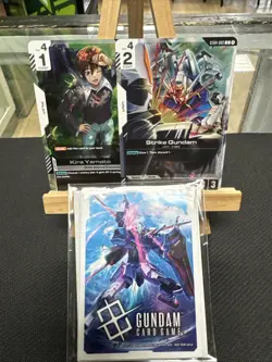 Gundam Card Game *ST04-002 C Strike Gundam Kira Promo Card English and sleeves* - Image 1