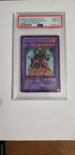 Yugioh - Elemental Hero Phoenix Enforcer EOJ-EN032 Ultra Rare 1st Edition PSA 8 - Image 1
