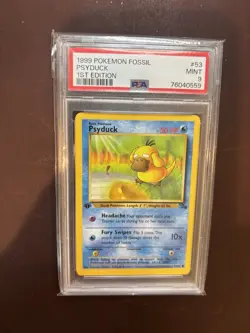 1999 POKEMON FOSSIL 1ST ED #53 PSYDUCK PSA 9 - Image 1