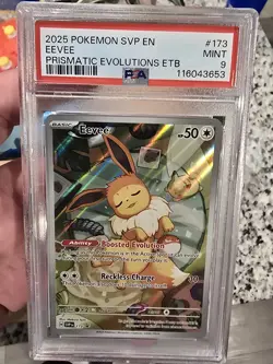 Pokemon TCG Eevee Prismatic Evolutions ETB Promo Card SVP 173 PSA 9 - Image 1