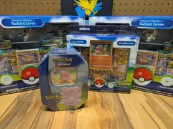 Pokemon Go Sealed Collection - 2x Eevee Boxes, Charmander Pin, Chansey Tin SWIRL - Image 1