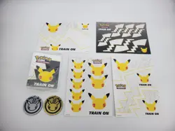 Pokemon TCG Accessory Lot: 25th Anniversary Stickers, Mini Binder, & Coins - Image 1
