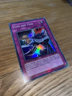 DP08-EN029 Give and Take Super Rare 1st Edition NM Yugioh Card - Image 2