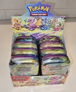 Pokemon TCG Prismatic Evolutions Mini Tin w/ Display Box (8 Tins Sealed) - Image 1