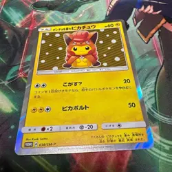 Vulpix Poncho Wearing Pikachu 038/SM-P Holo Promo Pokemon Card - Image 1