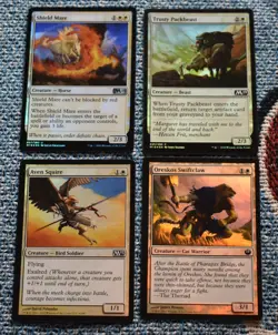 MTG 4x White FOIL Trusty Packbeast, Shield Mare, Oreskos Swiftclaw, Aven Squire - Image 1