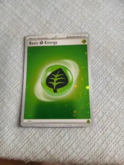 Pokemon TCG Basic Leaf Energy Cosmic Holo SVE 001 Pokemon 151 English NM - Image 1