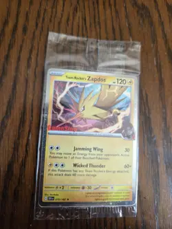 Team Rocket’s Zapdos Pokemon Promo Card - GameStop Exclusive - Holo Rare SEALED! - Image 1