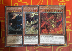 YUGIOH EGYPTIAN GOD SET PLATINUM SECRET RARE RA OBELISK SLIFER RA03-EN137 - Image 1