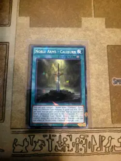 YUGIOH TCG NOBLE ARMS CALIBURN BP03-EN182 SHATTERFOIL 1ST EDITION - Image 1