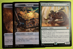 Goldvein Hydra Outlaws of Thunder Junction Regular w/2 Treasure Tokens - Image 1