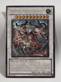 YuGiOh TCG Atomic Scrap Dragon STOR-EN043 Ultimate Rare 1st Edition NM - Image 1
