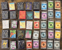 Assorted Pokemon ETB Energy Card Packs and Sleeves-Everything in Photo Included - Image 1