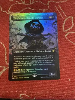 Tinybones, Bauble Burglar (Borderless) (Mana Foil) Foundations Foil - Image 1