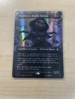 Tinybones, Bauble Burglar (Borderless) (Mana Foil) Foundations Foil - Image 1